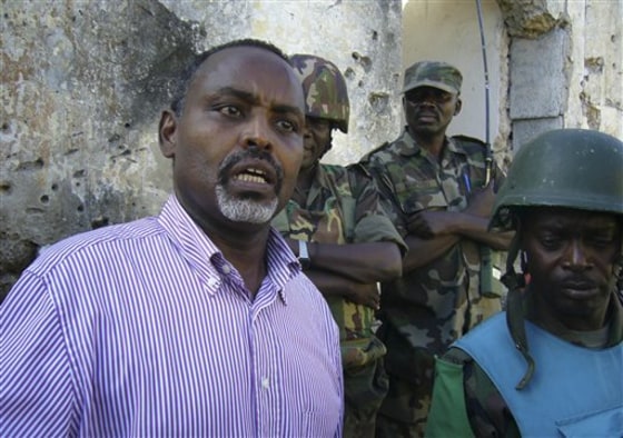 Mohamud Nur, left, the mayor of Mogadishu talks beside African Union Peacekeepers in Mogadishu, Somalia on Sept. 1. The new mayor of Somalia's capital has $50,000 a month, two computers and three Olivetti typewriters to help him provide education, health care and sanitation for one of the most devastated cities on the planet.